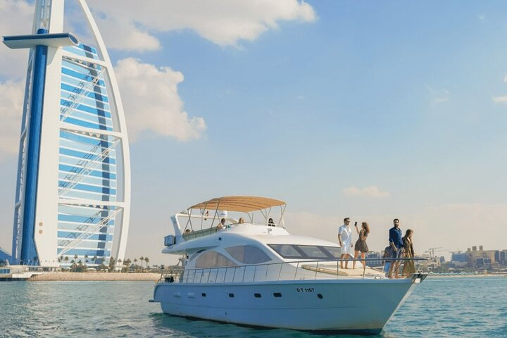 Experience the luxury of cruising Dubai's coast aboard a shared yacht savoring breathtaking views and indulging in a live BBQ perfect for creating unforgettable memories.